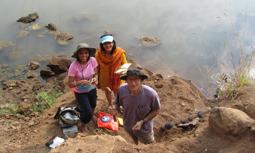 group of people in river bank