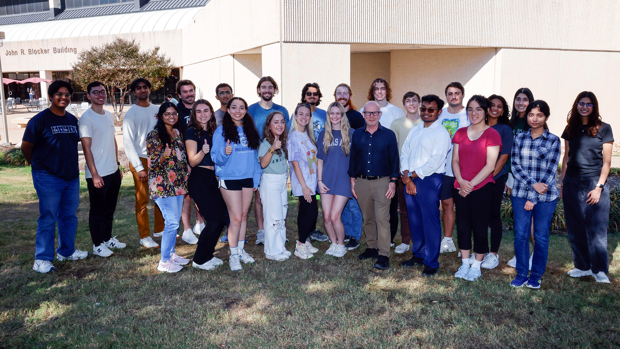 Dr. Matthew Sachs (center), posing with members of the fall 2024 BIOL 495 class outside the John R. Blocker Building on the Texas A&M campus.