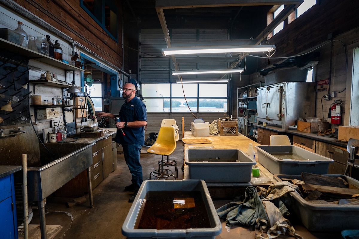 Texas A&M nautical archeologist Chris Dostal at work in the Conservation Research Laboratory