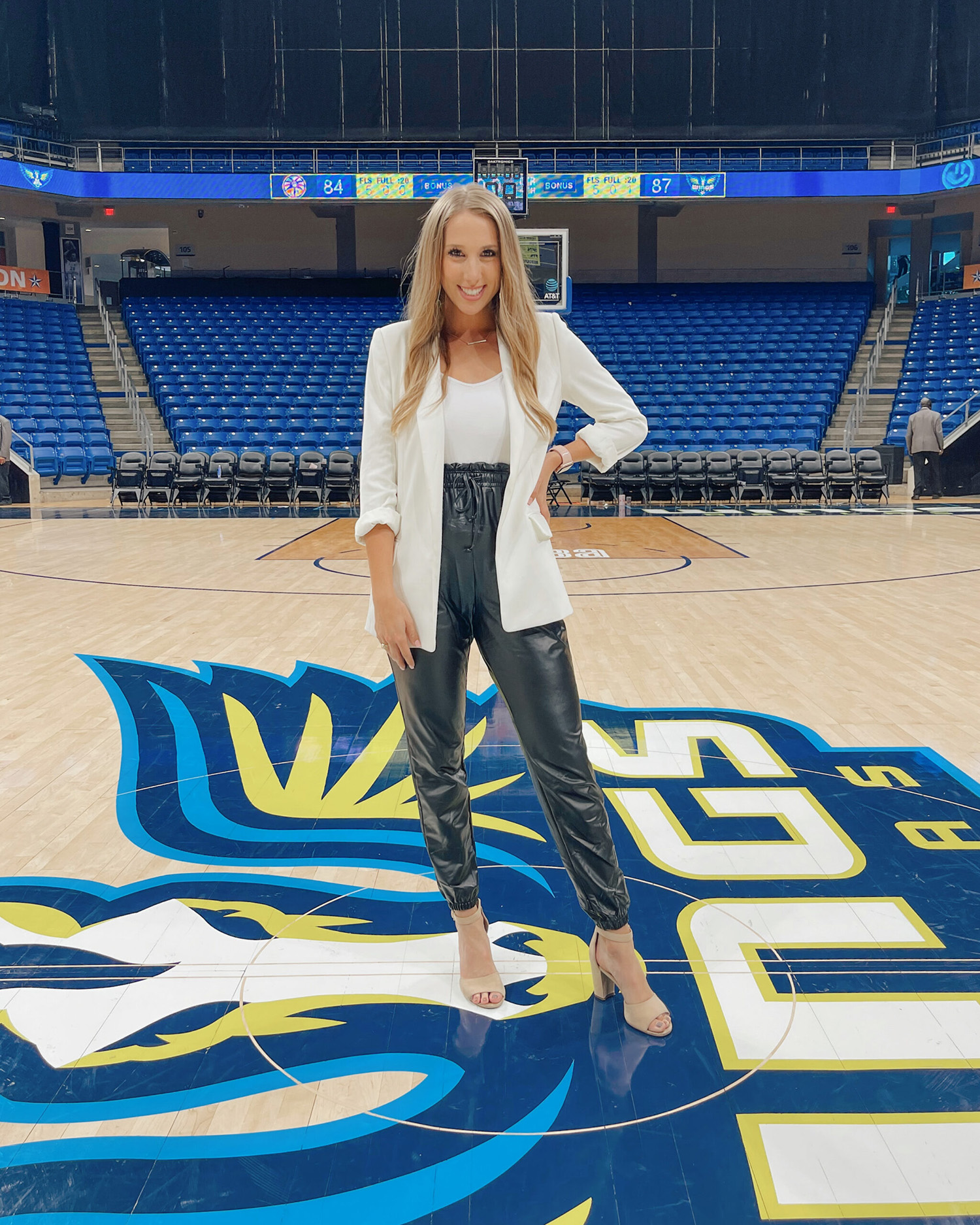 2019 Texas A&M telecommunications graduate Lia Musgrave stands at center court prior to covering a Dallas Wings game,
