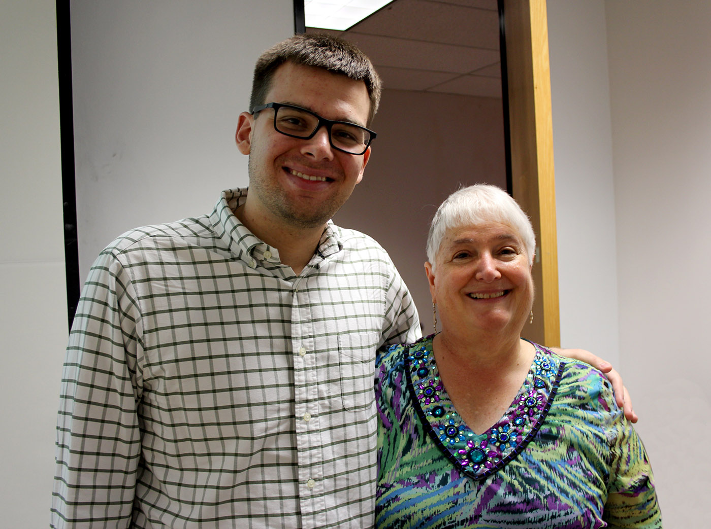 Texas A&M mathematician Sue Geller smiles alongside one of her many students -- specifically, her 100th master's graduate, James DeVinney