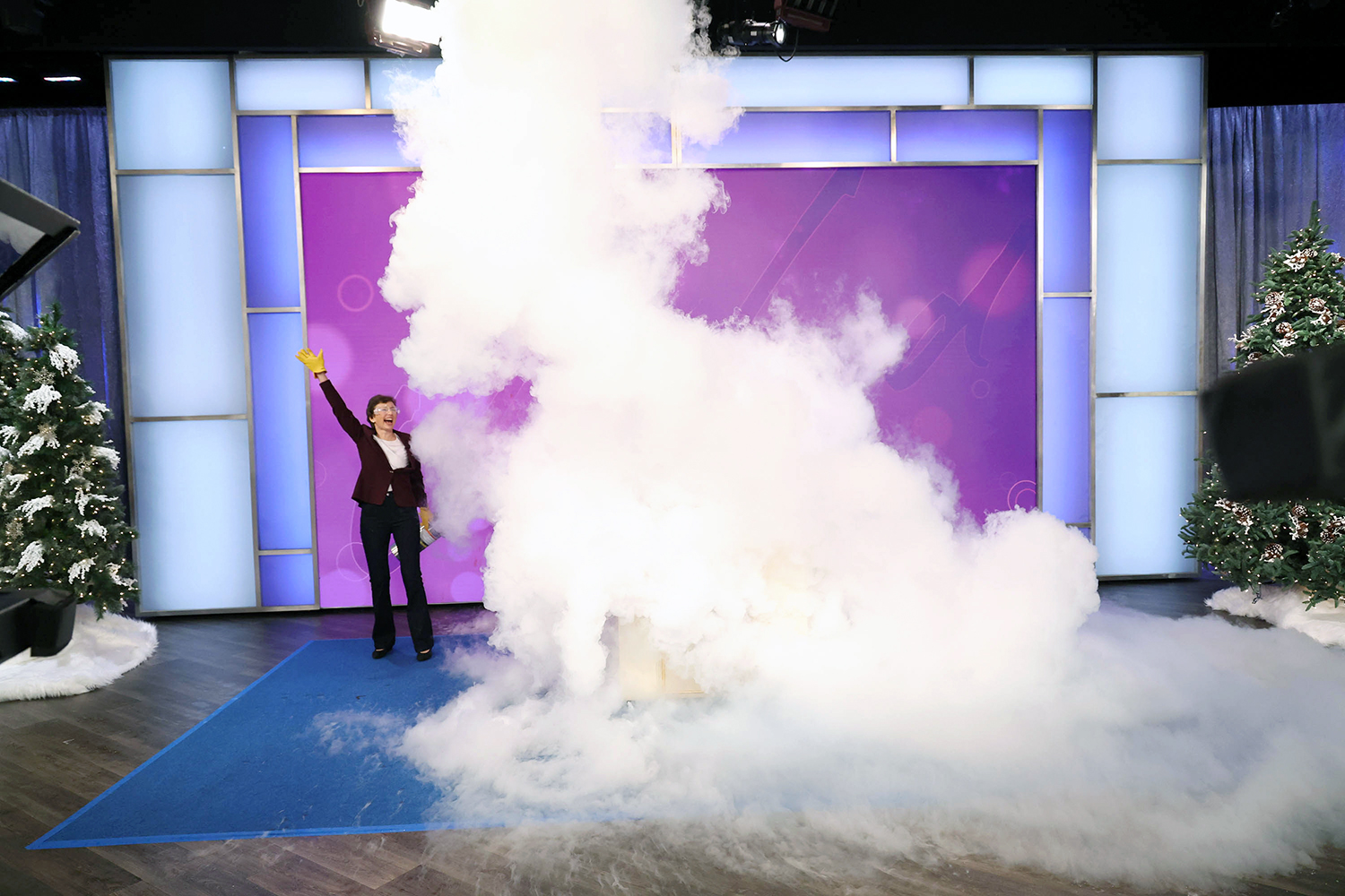 Texas A&M physicist Tatiana Erukhimova, enveloped by a big white cloud while wearing goggles and rubber gloves on the set of The Jennifer Hudson Show