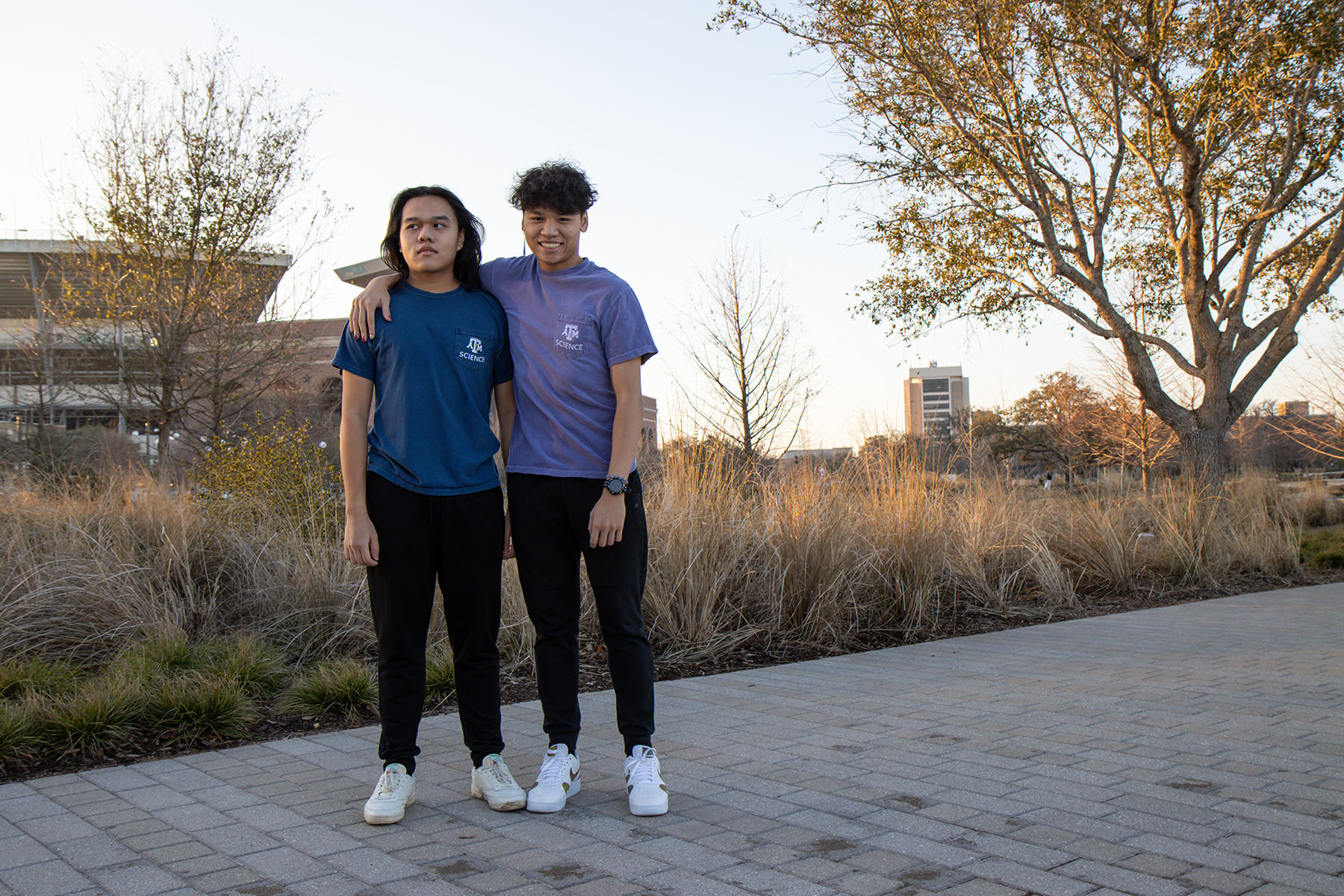 Texas A&M biology majors and brothers Henry and Kyle Nguyen in Aggie Park on the Texas A&M campus