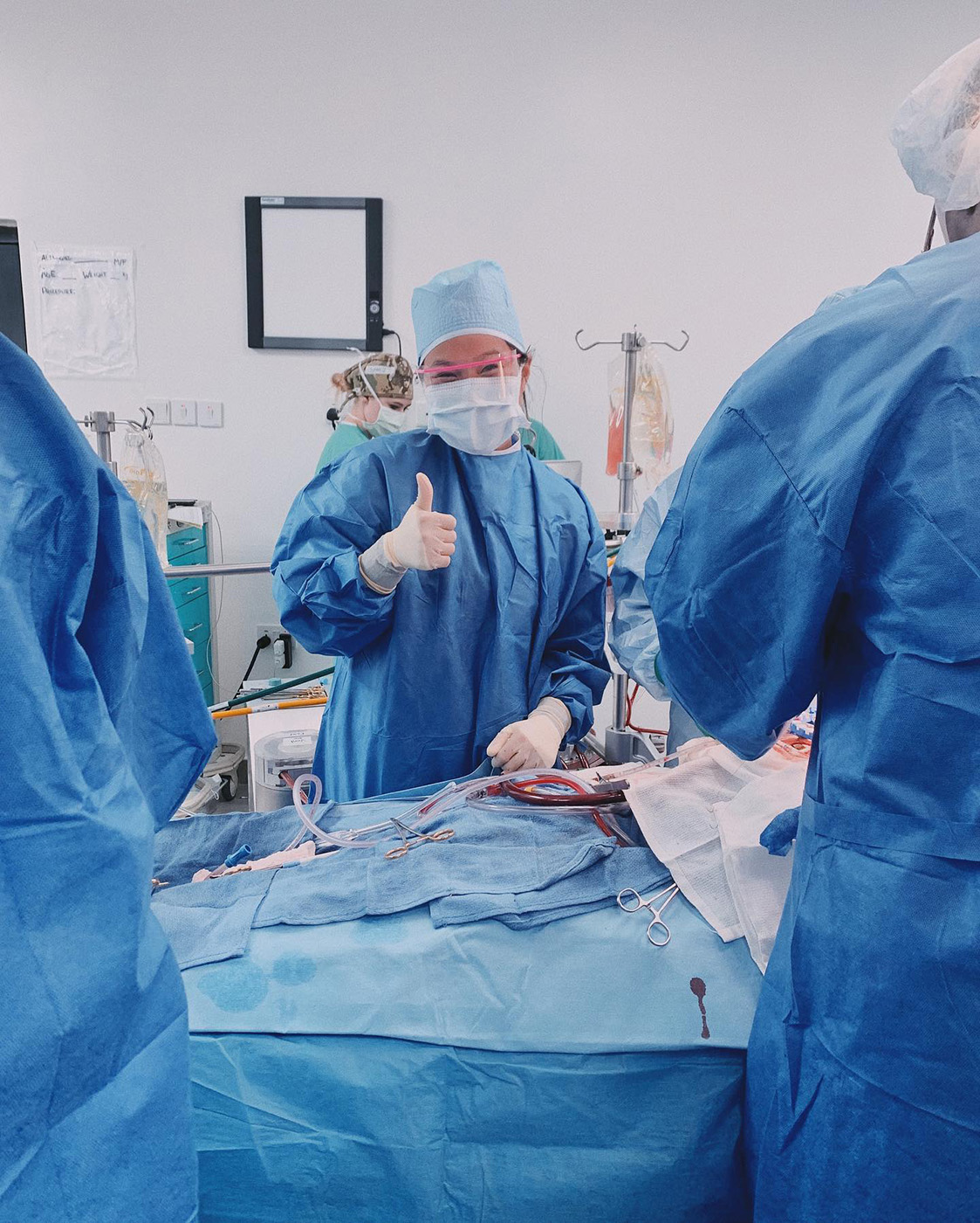 Texas A&M biomedical sciences major Mya Phelps, scrubbing in for open-heart surgery during her previous trip to Nigeria in May 2022