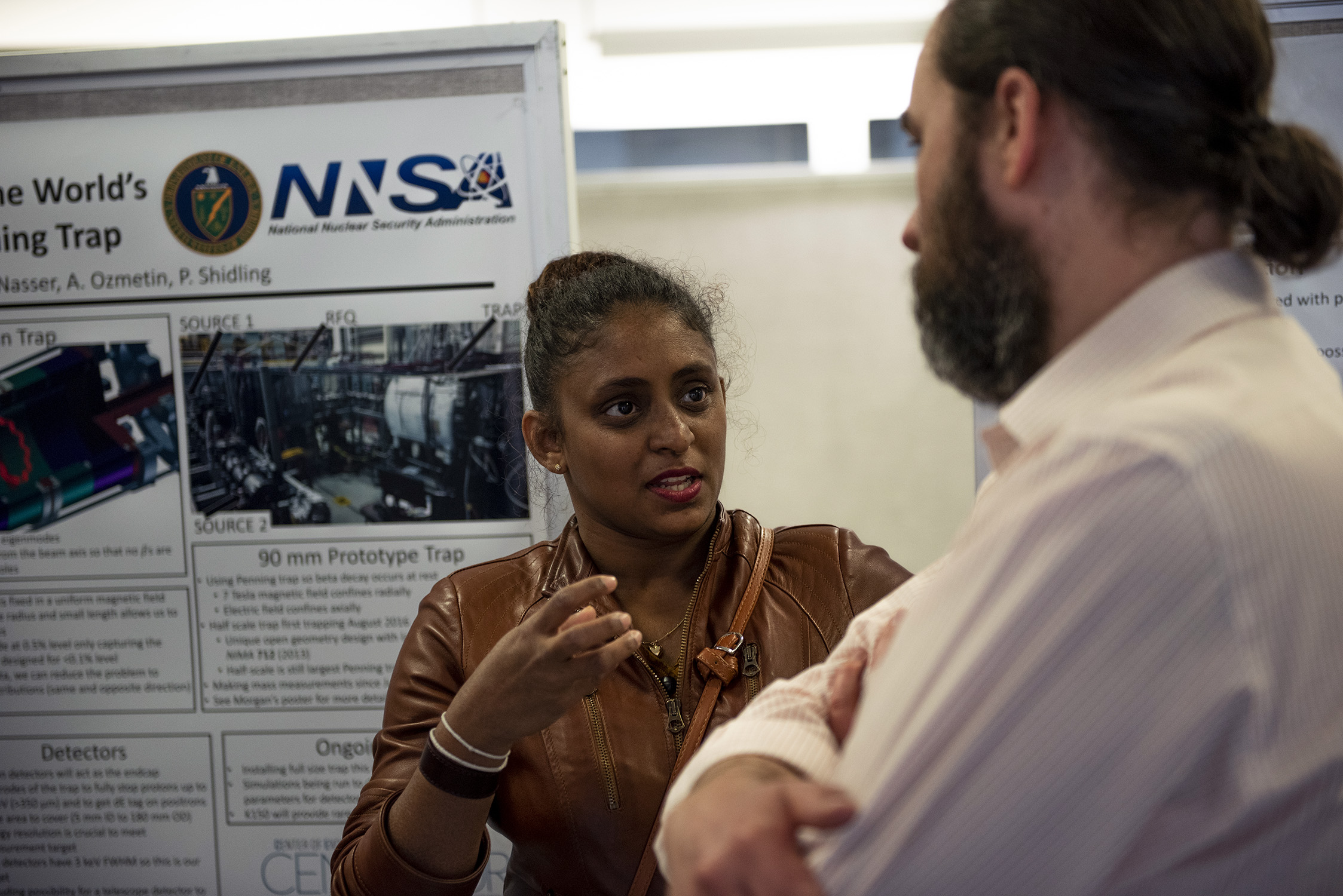 A female graduate student presents her research to a faculty mentor at Texas A&M University