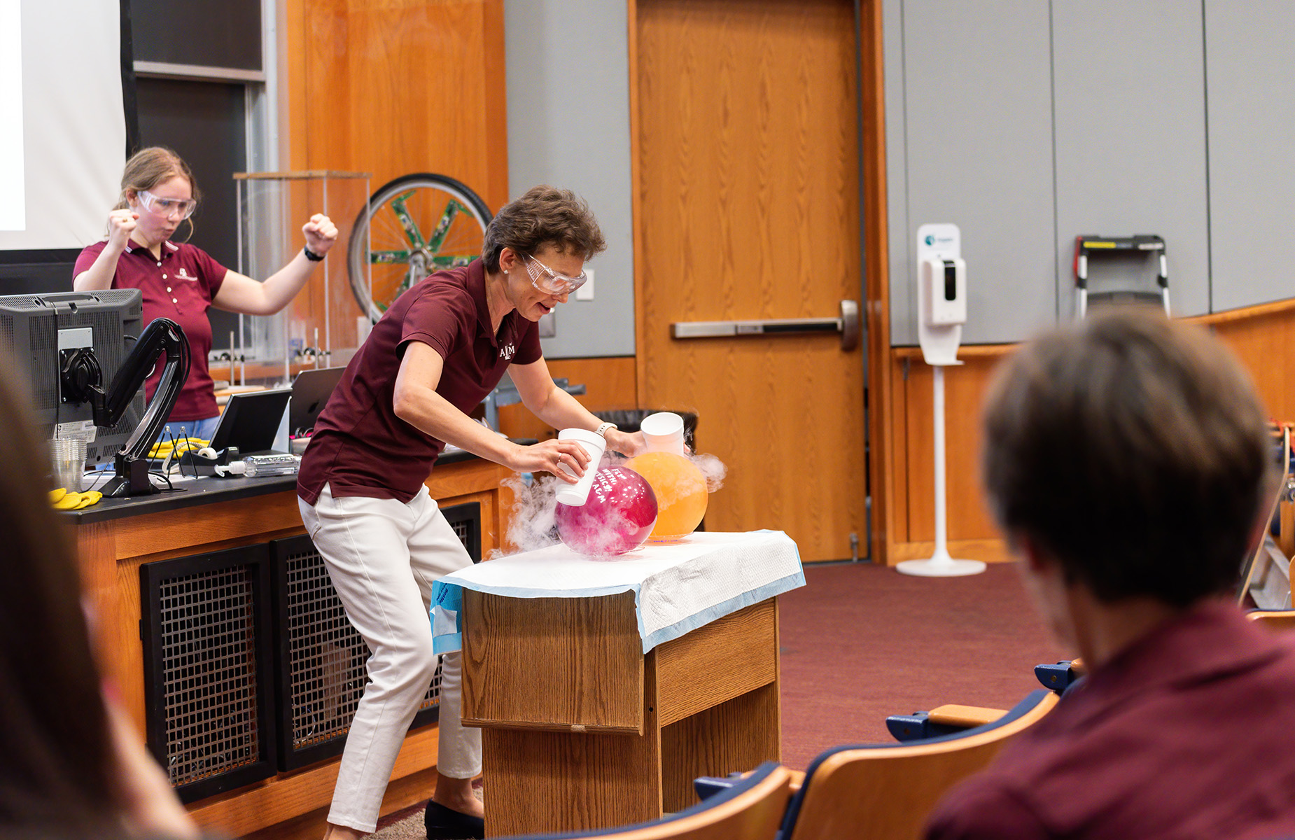Texas A&M physicist Tatiana Erukhimova performs an experiment at the Mitchell Institute Physics Enhancement Program for high school physics teachers