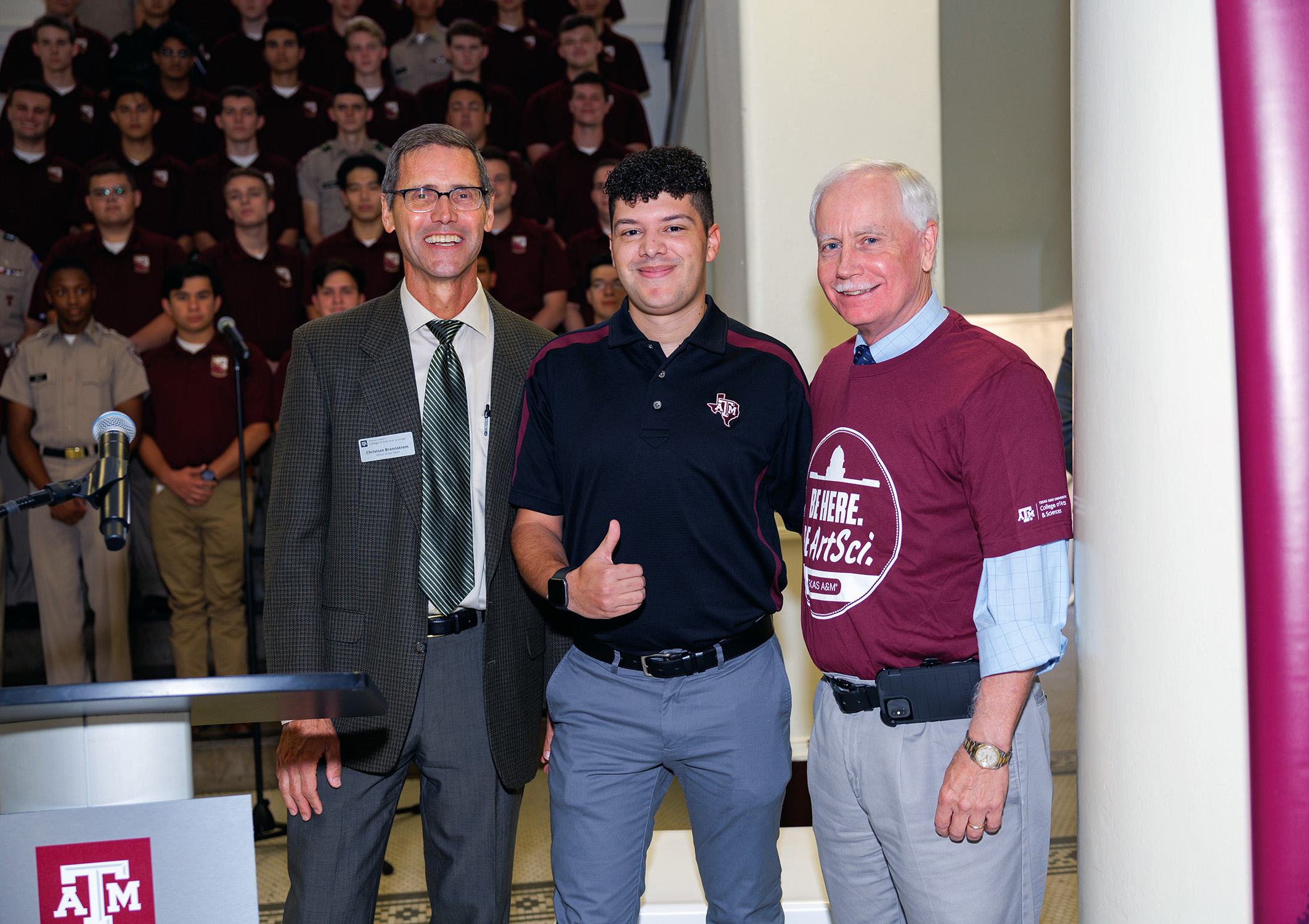 2020 Texas A&M University sociology graduate Seth Crouch (center), flanked by Arts and Sciences Senior Associate Dean for Undergraduate Education Dr. Christian Brannstrom (left) and Interim Dean Dr. Mark Zoran (right) at the ArtSci Party at the Plaza event held on Nov. 4, 2023.