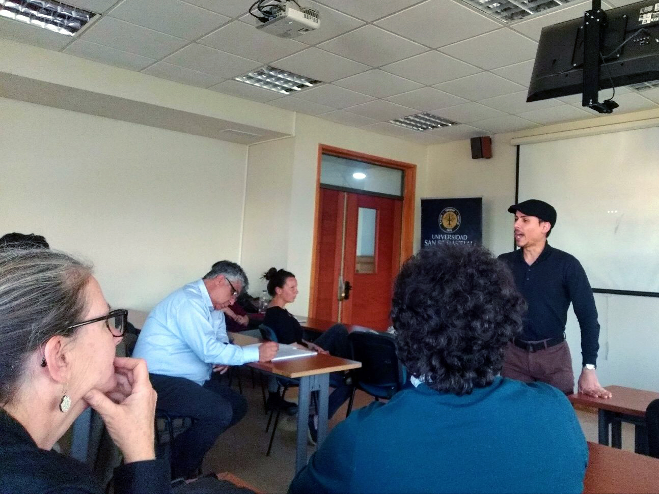 Texas A&M University doctoral student Daniel De Jesús presents a public lecture at Universidad San Sebastian on migratory bird research and related education efforts across Latin America