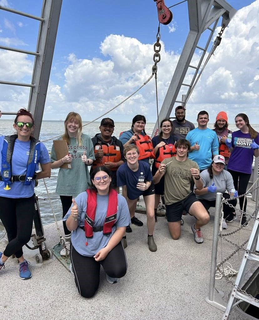 Group photo of Texas A&M University oceanography students on the deck of the RV Trident in spring 2023
