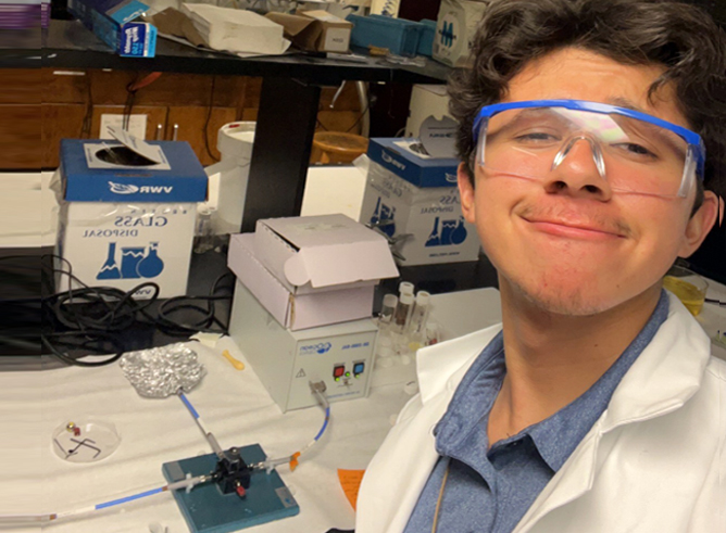 Texas A&M University chemical engineering major Juan Guio, working in a research laboratory within the Chemistry Building