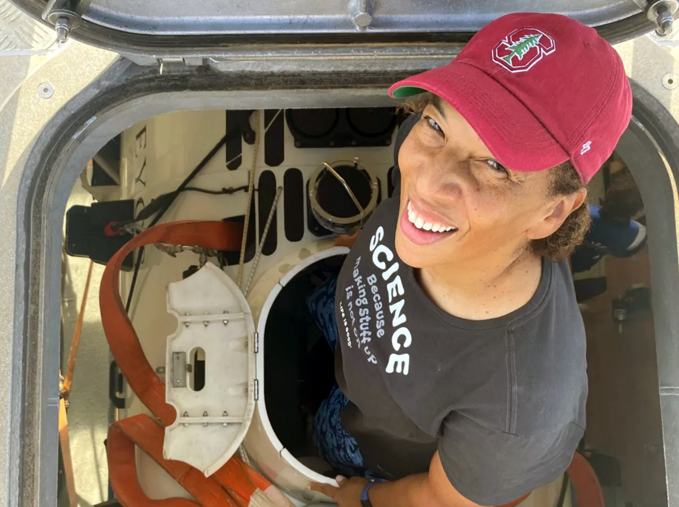 Texas A&M University oceanography former student Dawn Wright smiles while climbing out of the hatch of the submersible "The Limiting Factor"