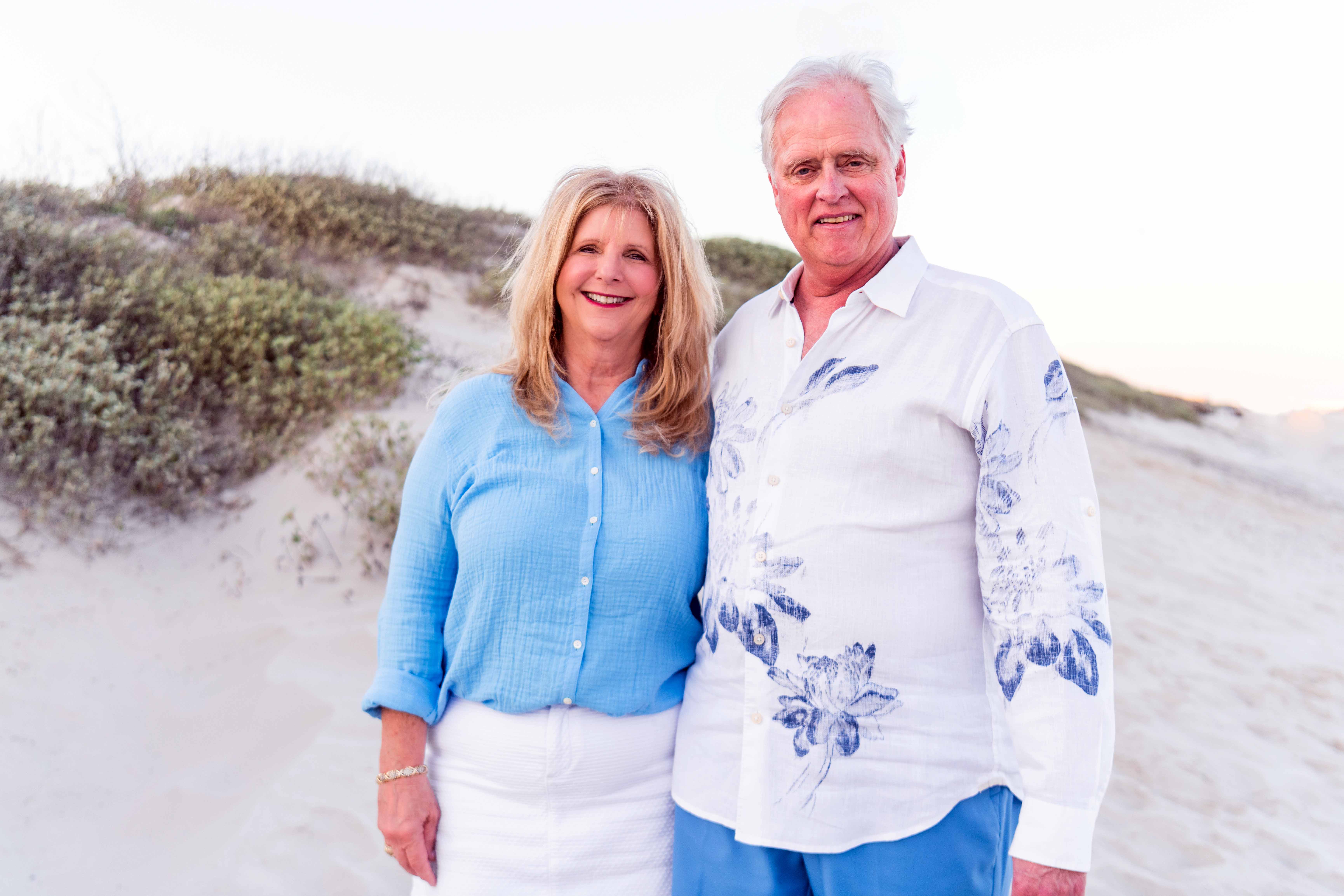 Texas A&M University former students and College of Arts and Sciences donors Clarissa and Steve Streetman smile for the camera while on a beach