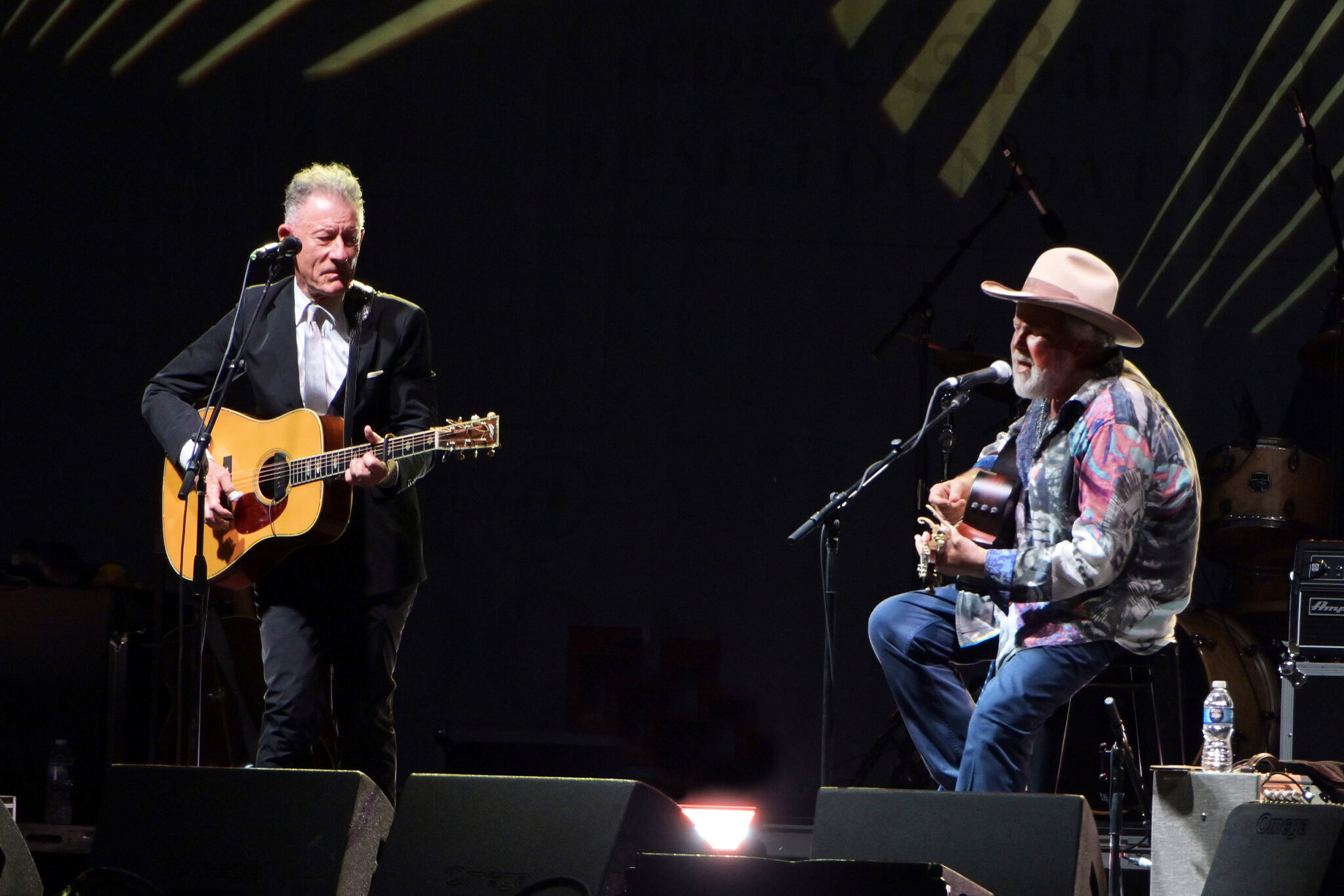 Texas A&M University former students and musicians Lyle Lovett and Robert Earl Keen perform on stage on the grounds of the George H.W. Bush Presidential Library and Museum during the Bush 41@100 Centennial Celebration on June 13, 2024