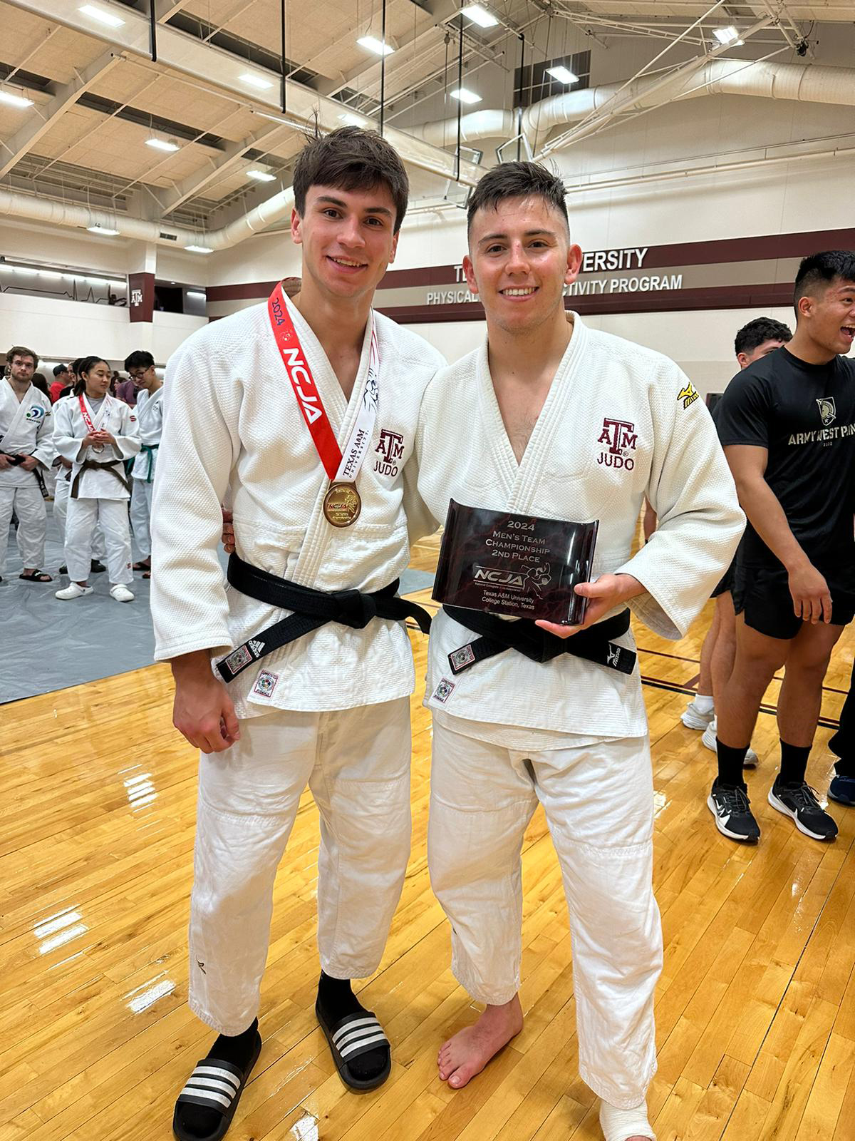Texas A&M University applied mathematics major Paolo Maaskant (left) and his brother Dario Maaskant pose with their second-place team finish plaque at the 2024 Collegiate National Championships hosted at Texas A&M University
