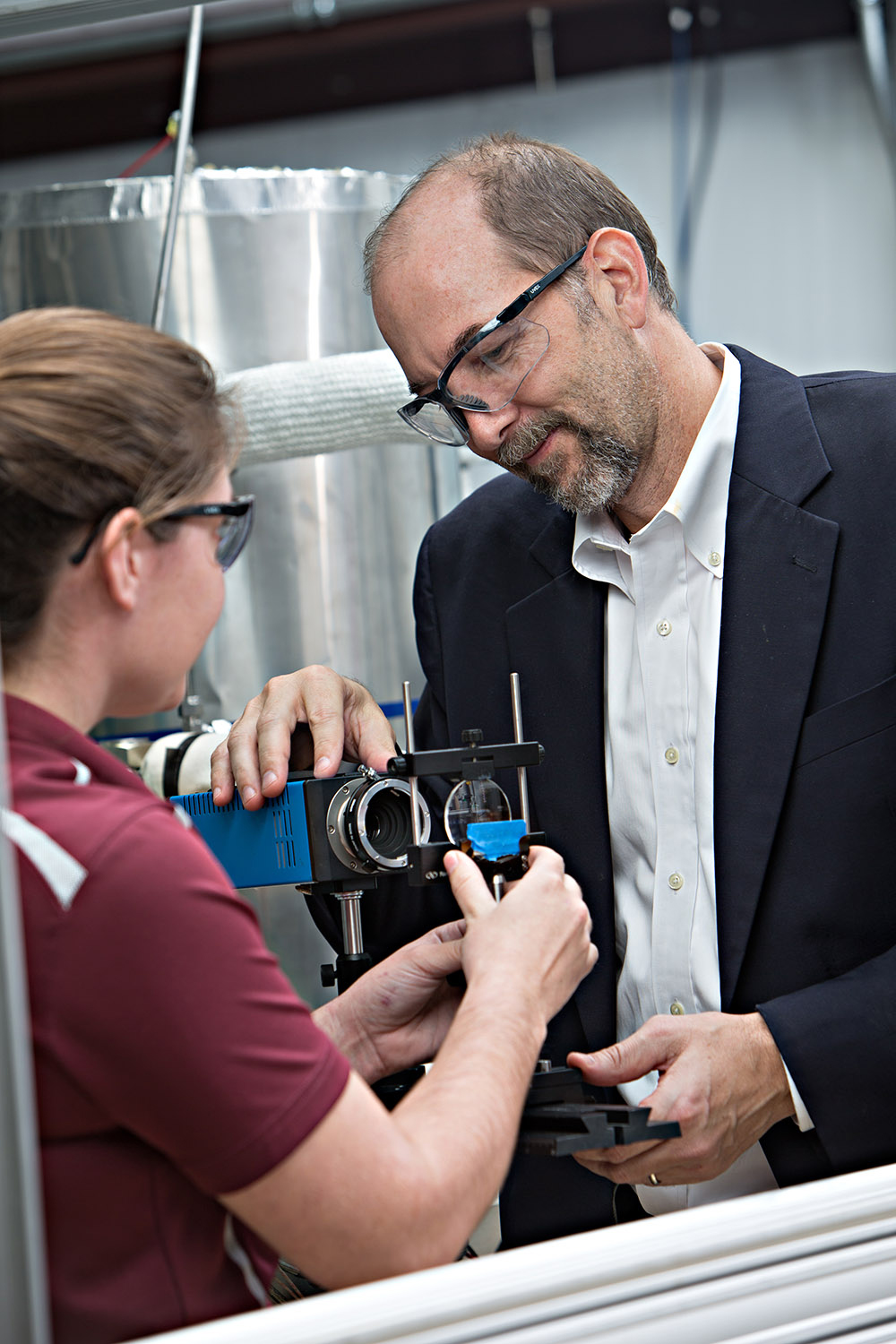 Simon North works wtih a student