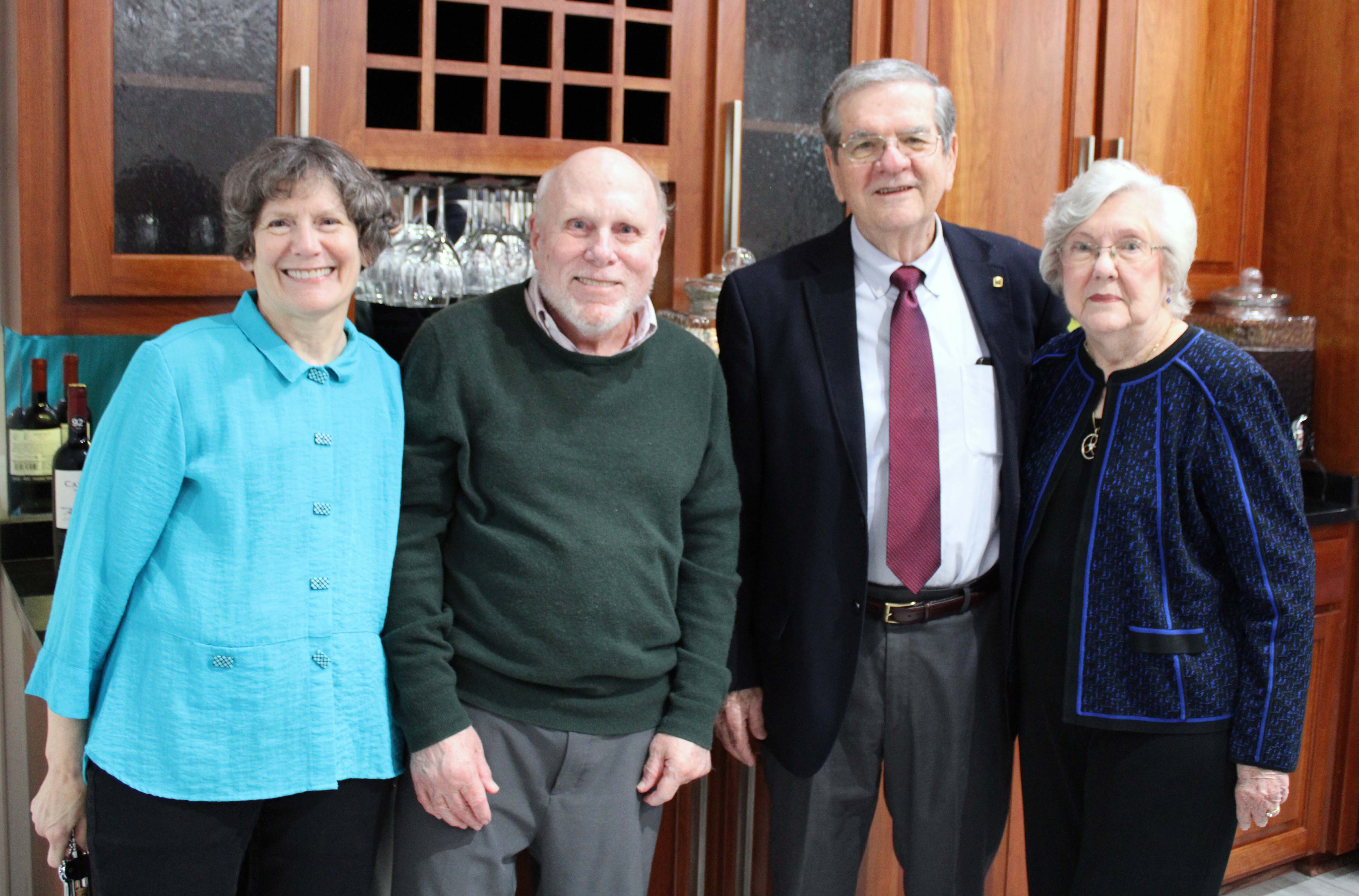 Texas A&M University statisticians Dr. William B. Smith and Dr. Raymond J. Carroll pose together with their wives, Patricia R. Smith and Dr. Marcia Ory, at the Texas A&M Department of Statistics' 60th anniversary celebration in fall 2022