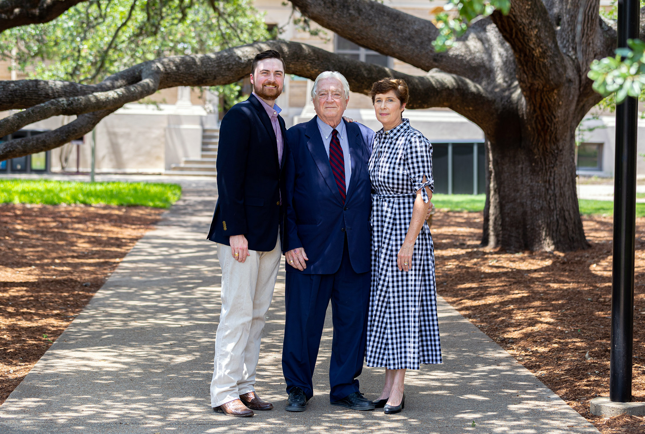 Luther, Luke and Andrea Soules stand under the Century Tree on the Texas A&M University campus
