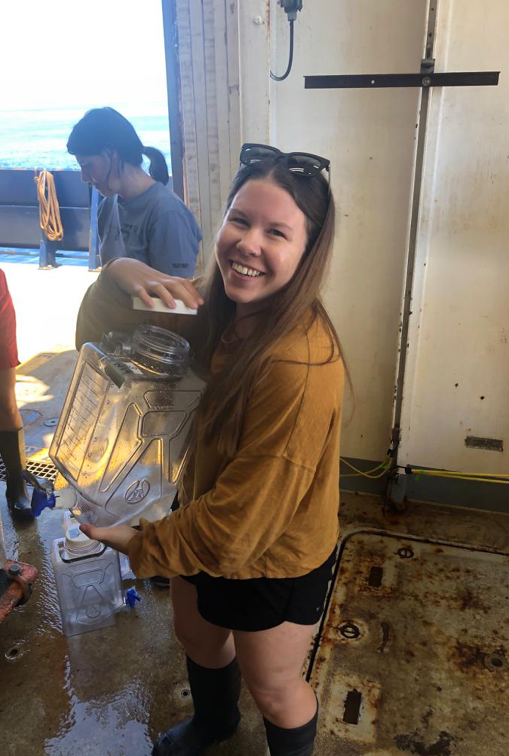 Alyssa Schultz collects water samples from different ocean depths during a research cruise in the North Pacific aboard the R/V Roger Revelle.