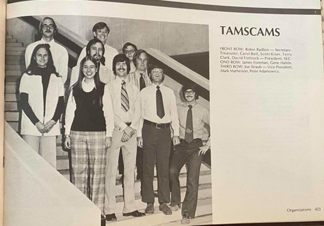 Group photo of eleven members of the TAMSCAMS organization on a staircase, with names of the visible people listed, including Robin Reskin and David Formánek. The photo is from the Texas A&M 1974 Yearbook.