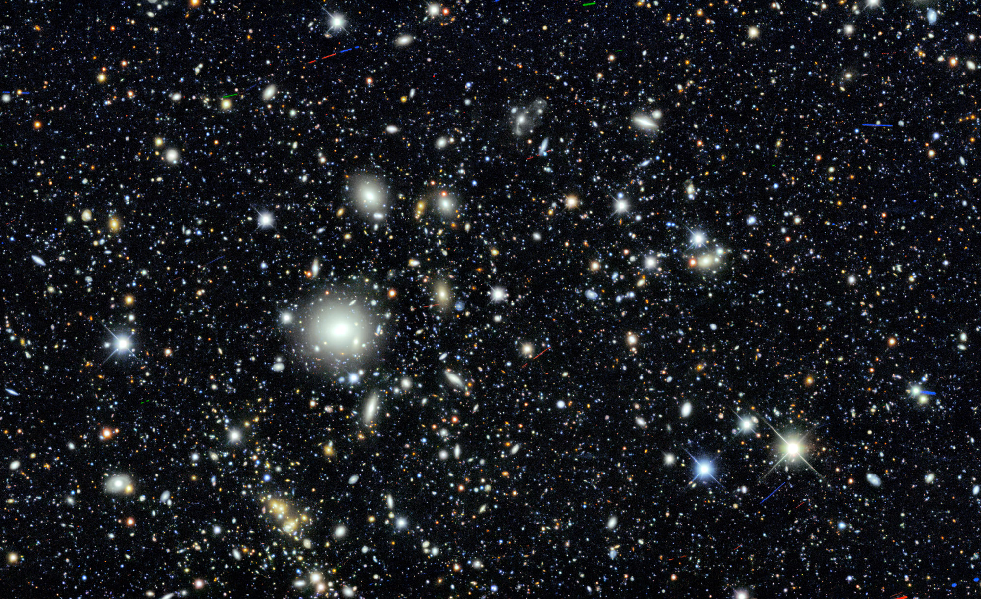 A vast starry sky filled with numerous stars, galaxies and nebulae, showcasing a deep space scene with varying brightness and colors against a predominantly black background.